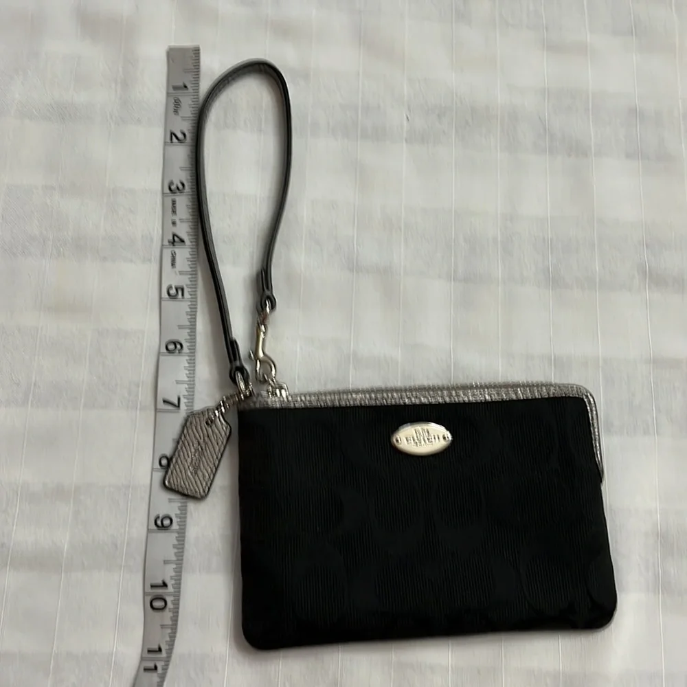 Coach black signature silver metallic leather edge wristlet
